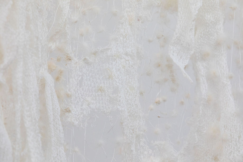 Detail shot of a lace making with materials of silk thread, goose down, and cotton.