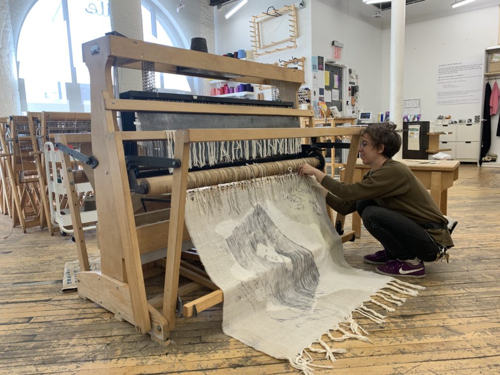Rowan at work on the loom