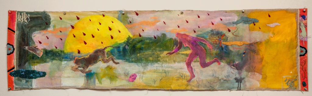 A beheaded figure and donkey, stumbling across a landscape in front of a giant yellow sun with beaded drops of blood.
